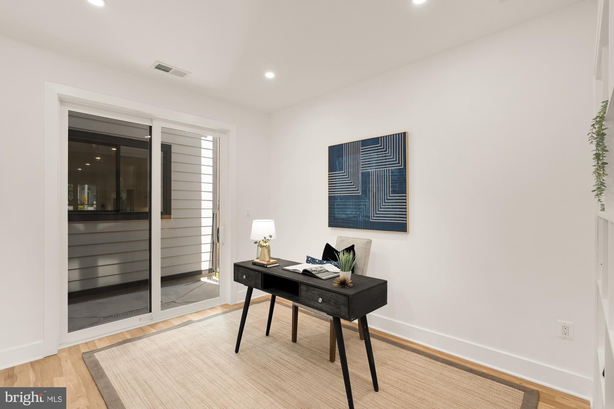 1251 Morse Street Northeast, Unit B Washington, DC 20002 - Photo 28 of 37 a workspace room with wooden floor and a rug