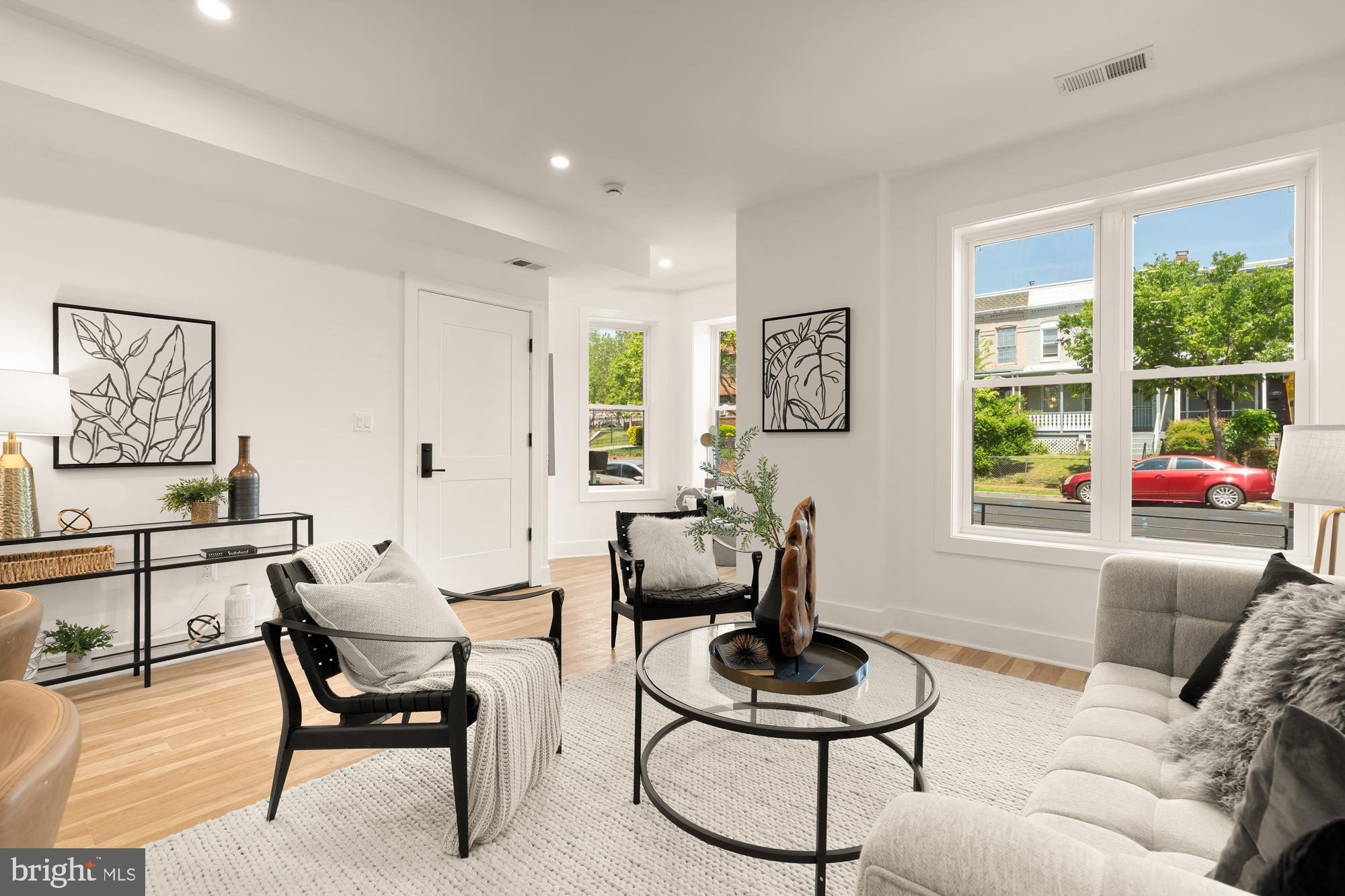1251 Morse Street Northeast, Unit B Washington, DC 20002 - Photo 3 of 37 a living room with furniture and a window