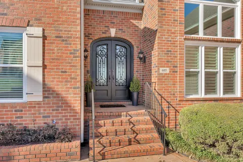 a view of balcony with wooden floor and outdoor seating