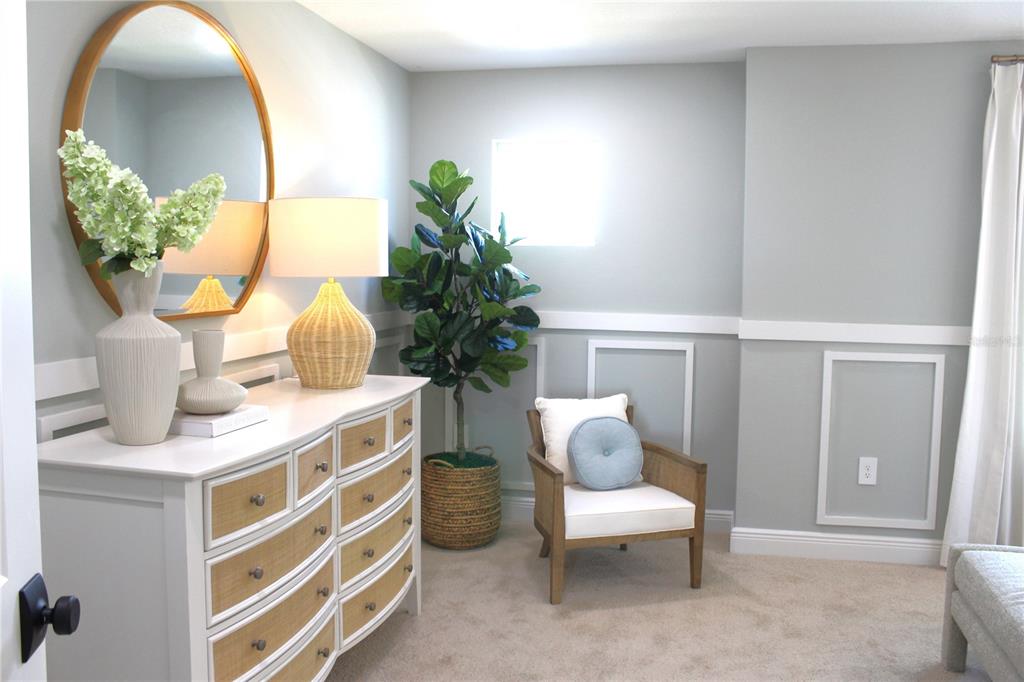 17706 Broadleaf Loop Venice, FL 34293 - Photo 6 of 16 a living room with furniture and a potted plant