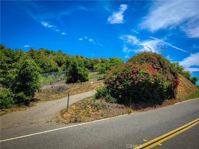 a view of a street with a building in the background