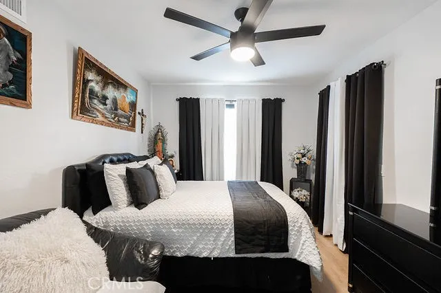 a view of living room with furniture and a floor to ceiling window