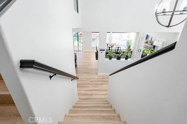 an empty room with a ceiling fan and a window