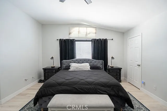 a dining room with furniture and a floor to ceiling window