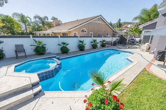 a view of a swimming pool with a lake view