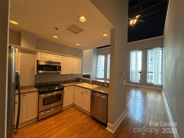 a view of livingroom with wooden floor