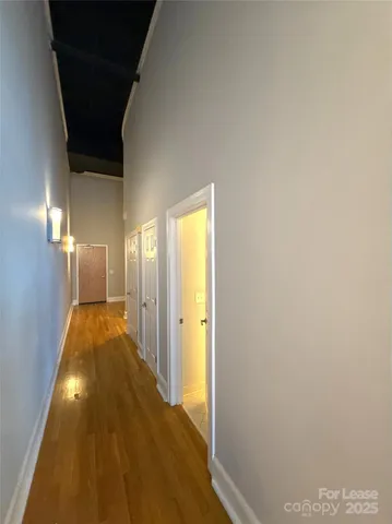 a view of a big room with windows