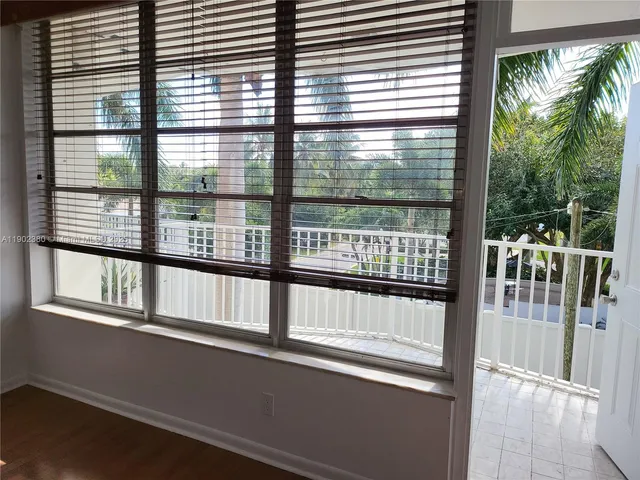 a view of swimming pool with outdoor seating and a potted plant