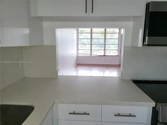 a view of an empty room with a window