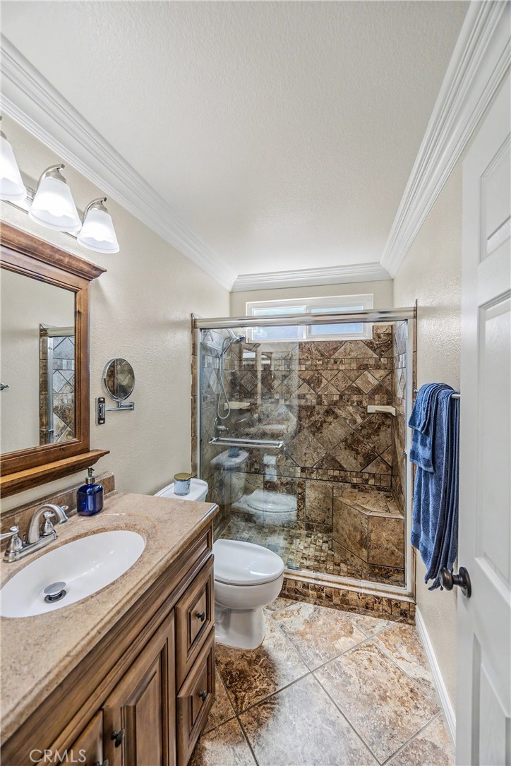 43121 Corte Cabrera Temecula, CA 92592 - Photo 11 of 17 a bathroom with a sink toilet and shower