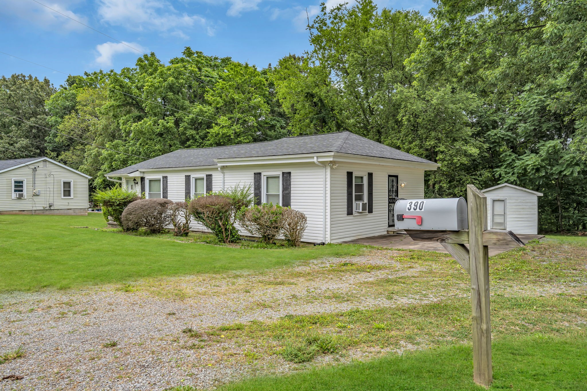 390 Southside Road Cunningham, TN 37052 - Photo 2 of 22 a front view of a house with garden