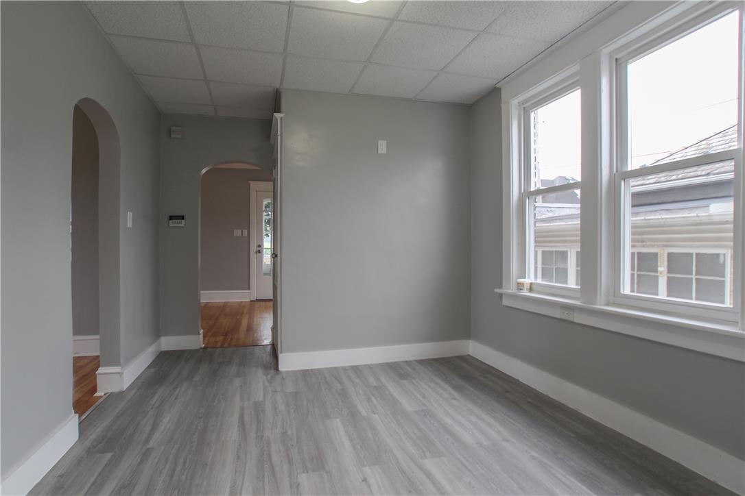 933 Philadelphia Road Easton, PA 18042 - Photo 8 of 23 Classic arched doorways and clean wood-look flooring define this versatile interior space.