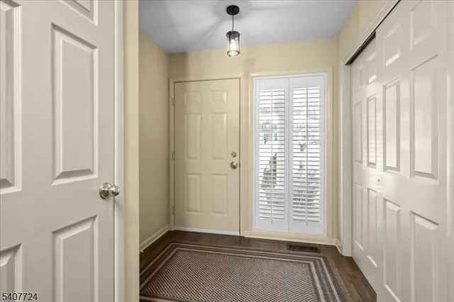 a view of a hallway with windows