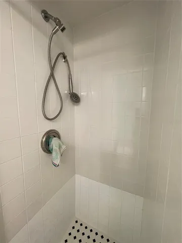 a bedroom with bed and a window