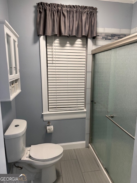 430 Bethany Road Covington, GA 30016 - Photo 16 of 39 a bathroom with a sink a toilet and shower