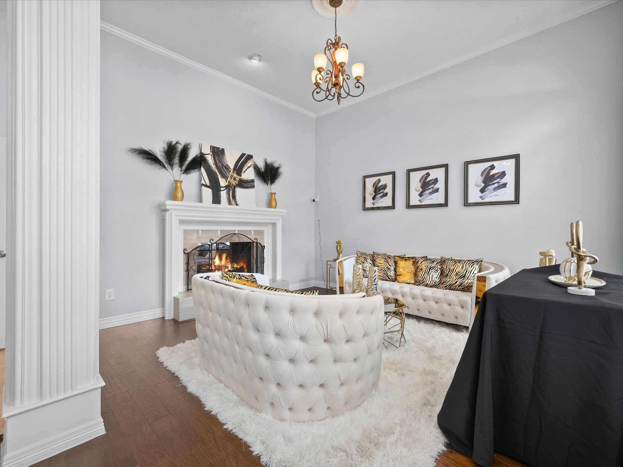 16123 Lafone Drive Spring, TX 77379 - Photo 11 of 47 Soaring ceilings, abundant natural light, and a beautiful fireplace create a stunning formal living space that feels both grand and inviting.