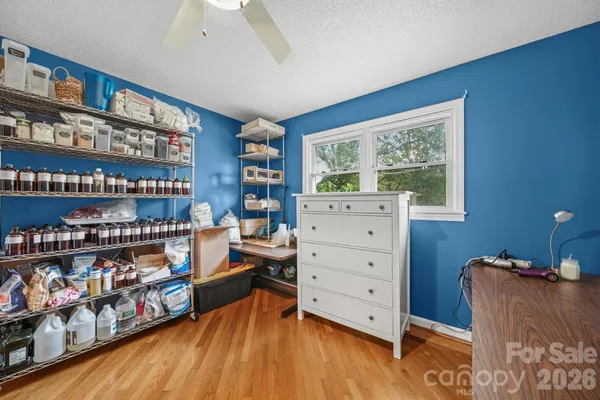 a room with lots of furniture and a book shelf