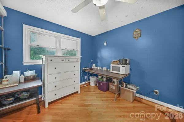 a room with a desk and a window