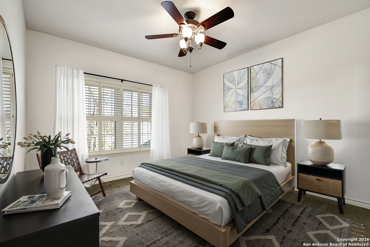 2642 Rim Oak San Antonio, TX 78232 - Photo 14 of 24 a bedroom with a bed and wooden floor