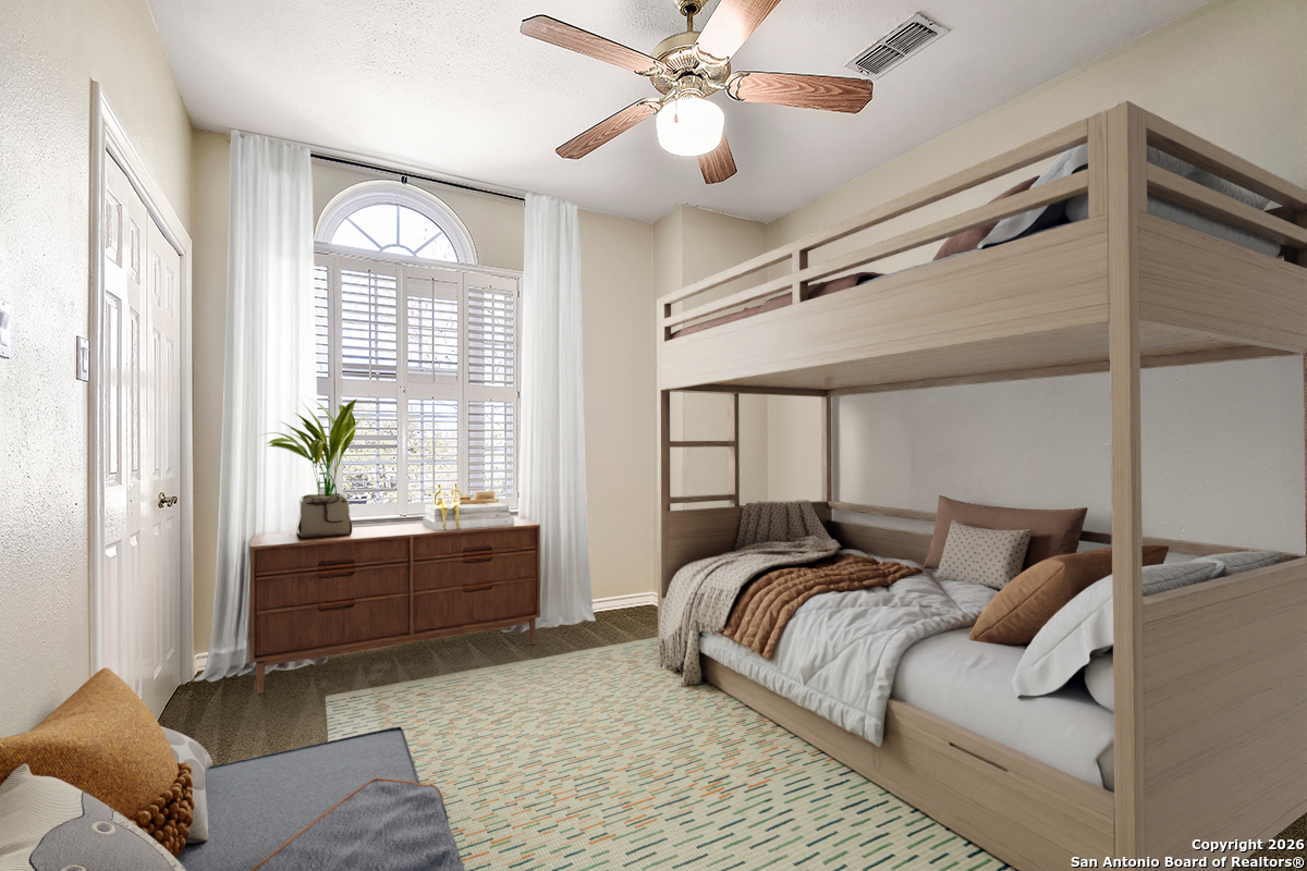 2642 Rim Oak San Antonio, TX 78232 - Photo 19 of 24 a bedroom with a bed and window