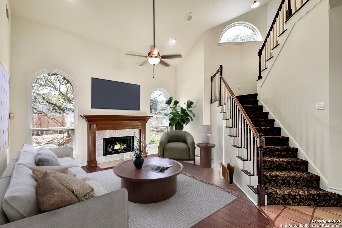 2642 Rim Oak San Antonio, TX 78232 - Photo 2 of 24 a living room with furniture and a fireplace