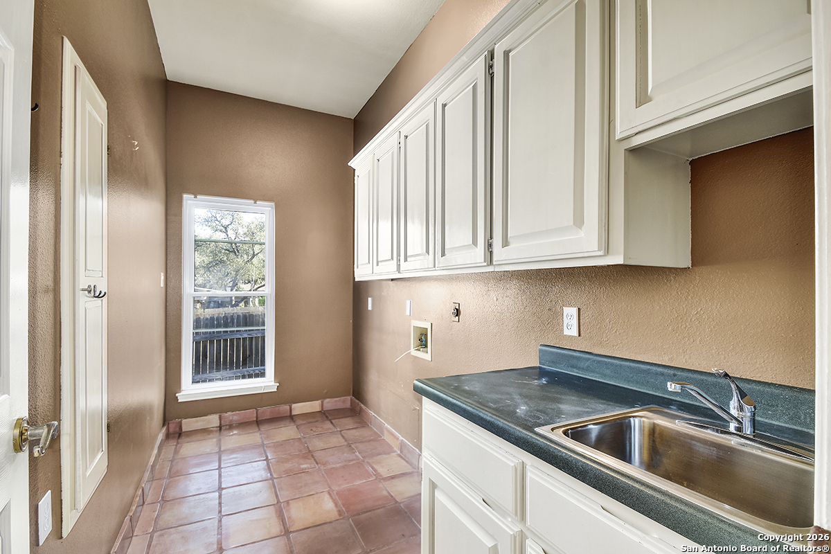 2642 Rim Oak San Antonio, TX 78232 - Photo 21 of 24 a kitchen with stainless steel appliances granite countertop a sink and dishwasher