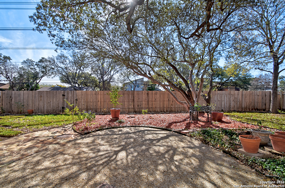 2642 Rim Oak San Antonio, TX 78232 - Photo 23 of 24 a backyard of a house with table and chairs