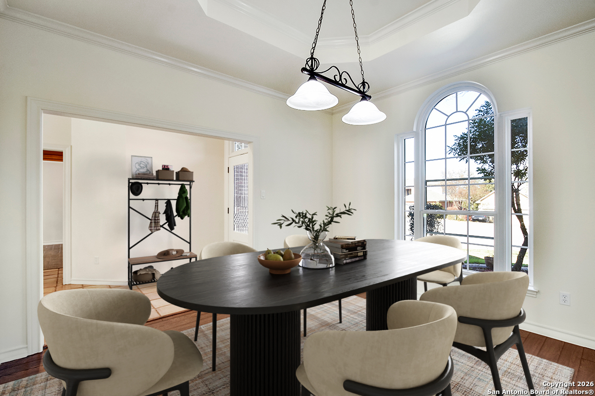 2642 Rim Oak San Antonio, TX 78232 - Photo 4 of 24 a view of a dining room with furniture window and wooden floor