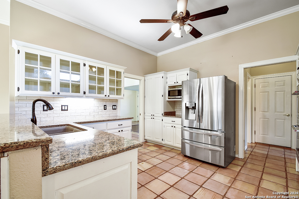 2642 Rim Oak San Antonio, TX 78232 - Photo 5 of 24 a kitchen with stainless steel appliances granite countertop a refrigerator and a sink