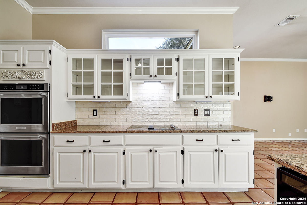 2642 Rim Oak San Antonio, TX 78232 - Photo 6 of 24 a kitchen with granite countertop a sink and a stove