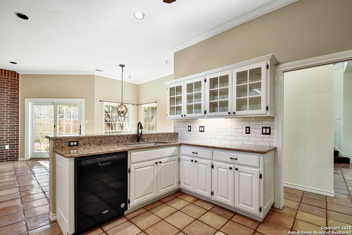 2642 Rim Oak San Antonio, TX 78232 - Photo 7 of 24 a kitchen with a sink stove and cabinets