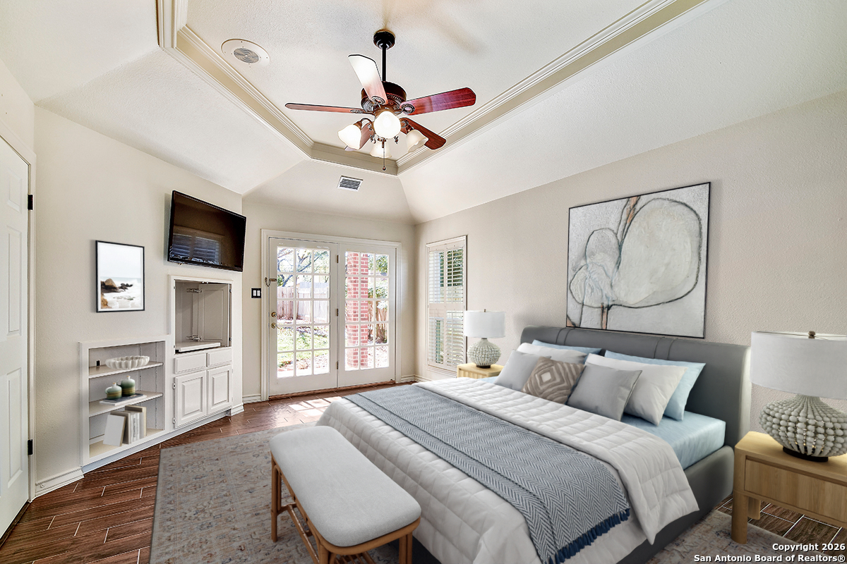 2642 Rim Oak San Antonio, TX 78232 - Photo 10 of 24 a bedroom with a large bed a flat tv screen and dresser