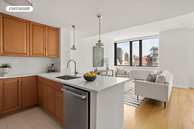 a kitchen with a sink cabinets and window
