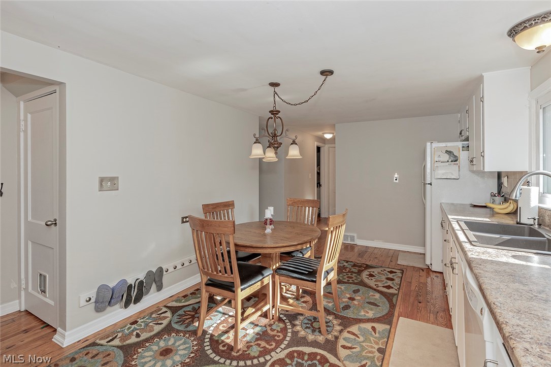106 Fernwood Road Chagrin Falls, OH 44022 - Photo 12 of 28 Eat in kitchen; to the left in photo is door to full basement. Not pictured opposite is side door to deck.