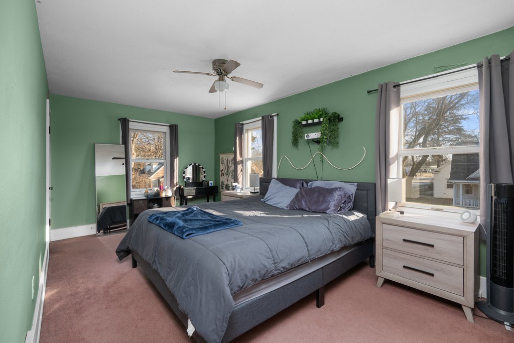 2545 18th Avenue A Moline, IL 61265 - Photo 19 of 28 a bedroom with a large bed and a window