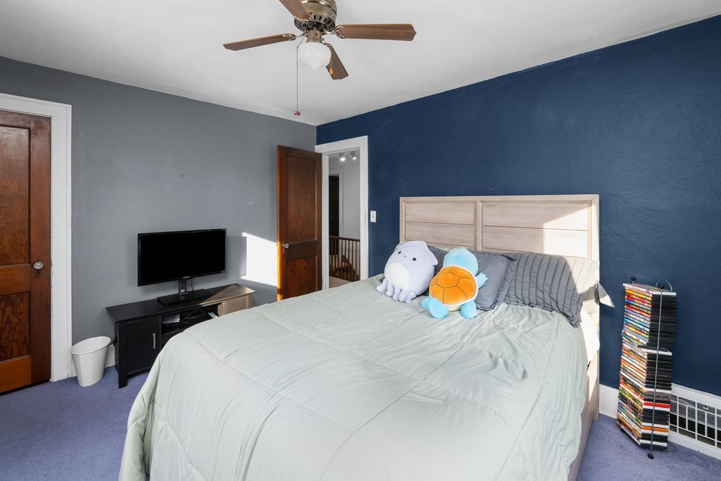 2545 18th Avenue A Moline, IL 61265 - Photo 22 of 28 a bedroom with a bed and a flat screen tv