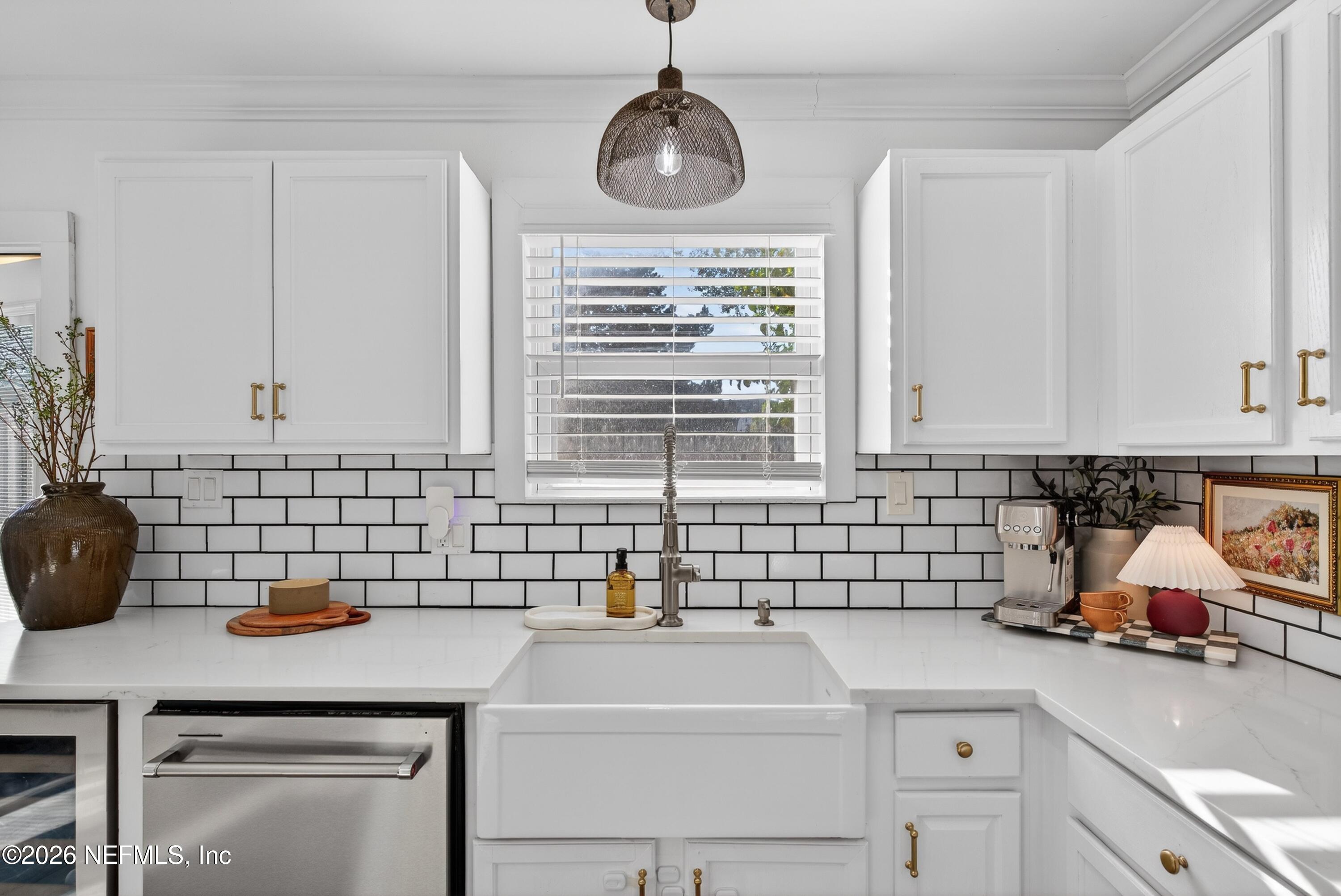 1110 Scheidel Court Atlantic Beach, FL 32233 - Photo 13 of 24 a kitchen with a sink cabinets and window