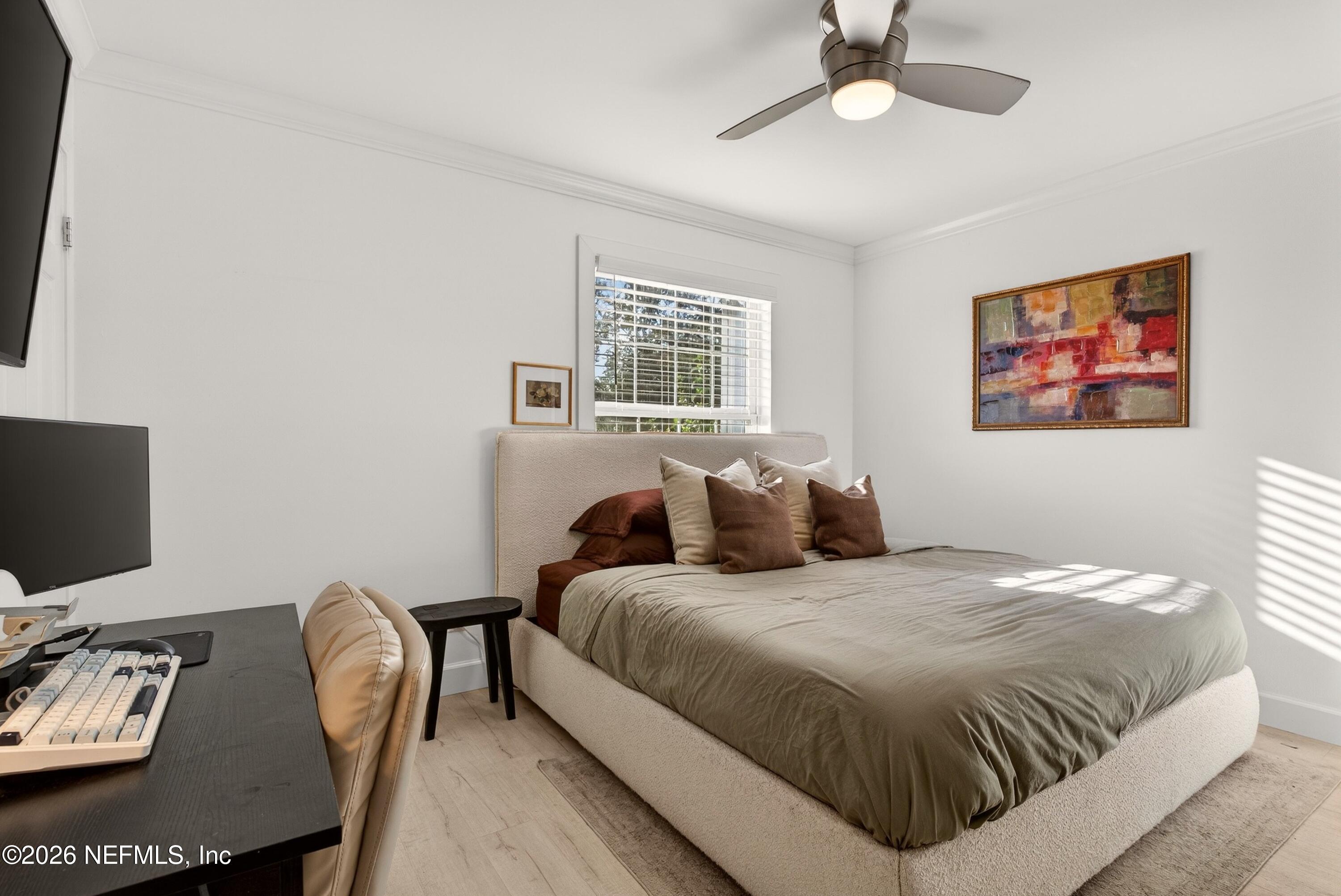 1110 Scheidel Court Atlantic Beach, FL 32233 - Photo 20 of 24 a bedroom with a bed a computer on a desk and chair