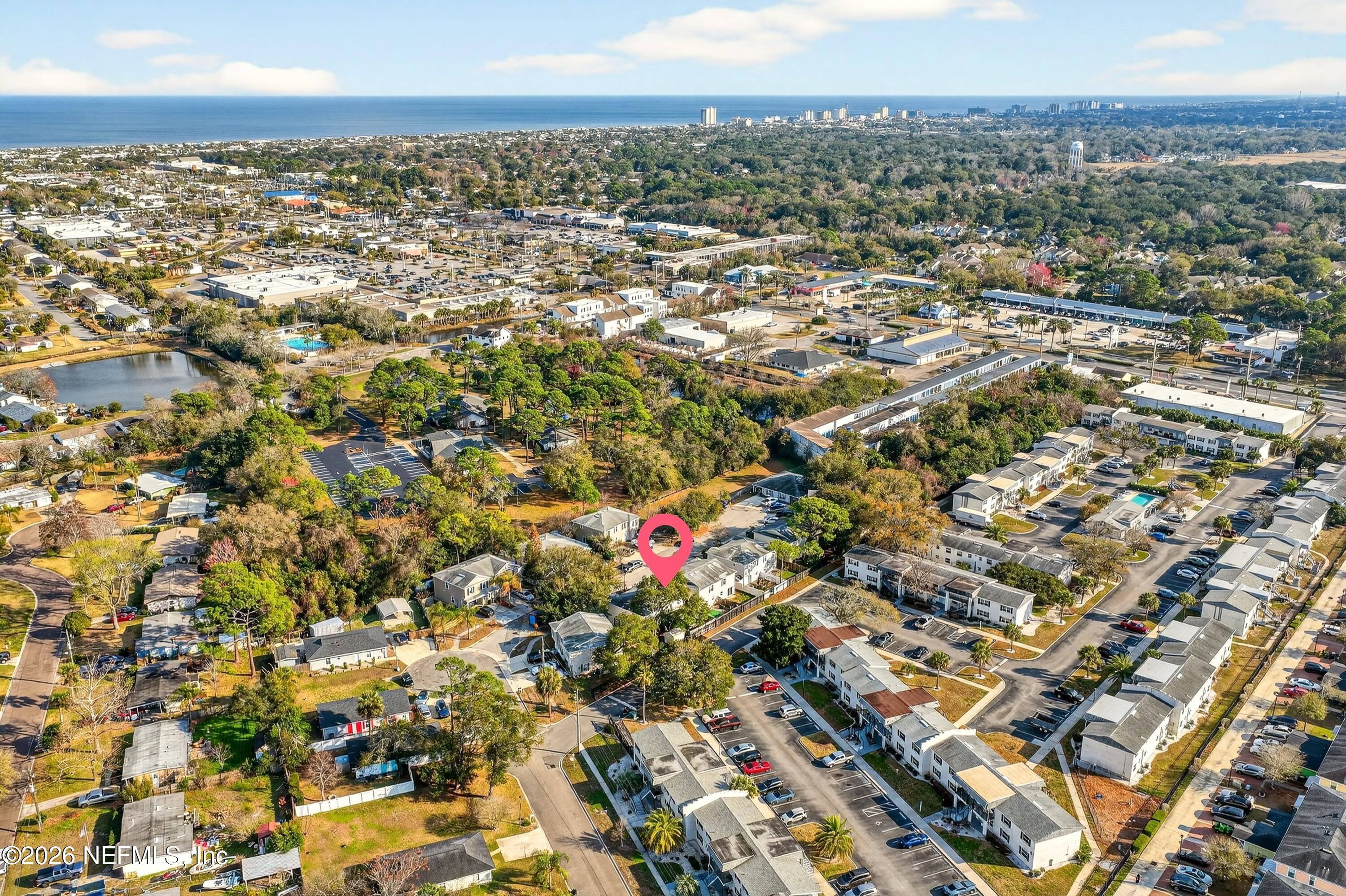 1110 Scheidel Court Atlantic Beach, FL 32233 - Photo 2 of 24 an aerial view of residential houses with outdoor space and trees