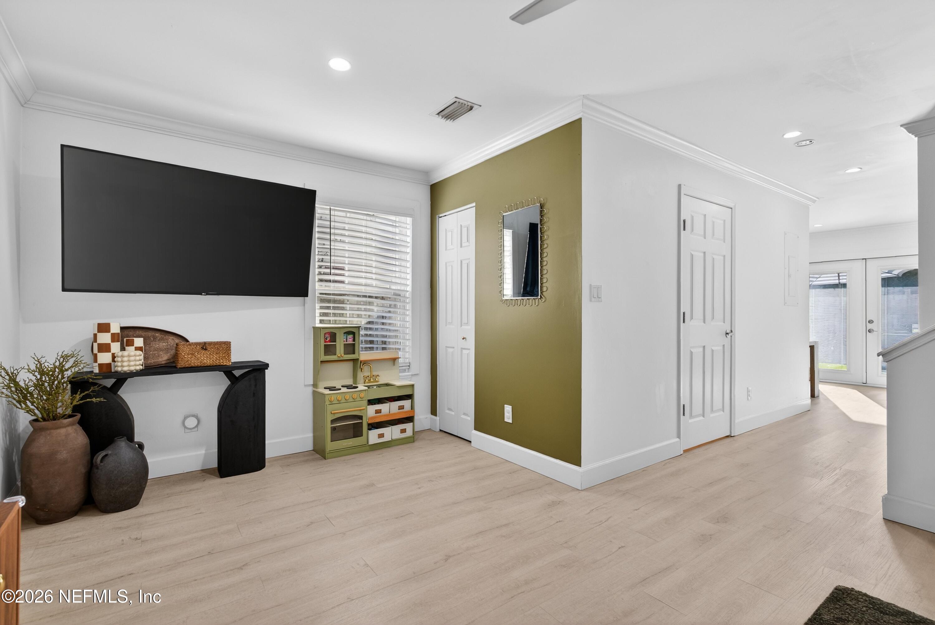 1110 Scheidel Court Atlantic Beach, FL 32233 - Photo 8 of 24 a view of a livingroom with furniture and a flat screen tv