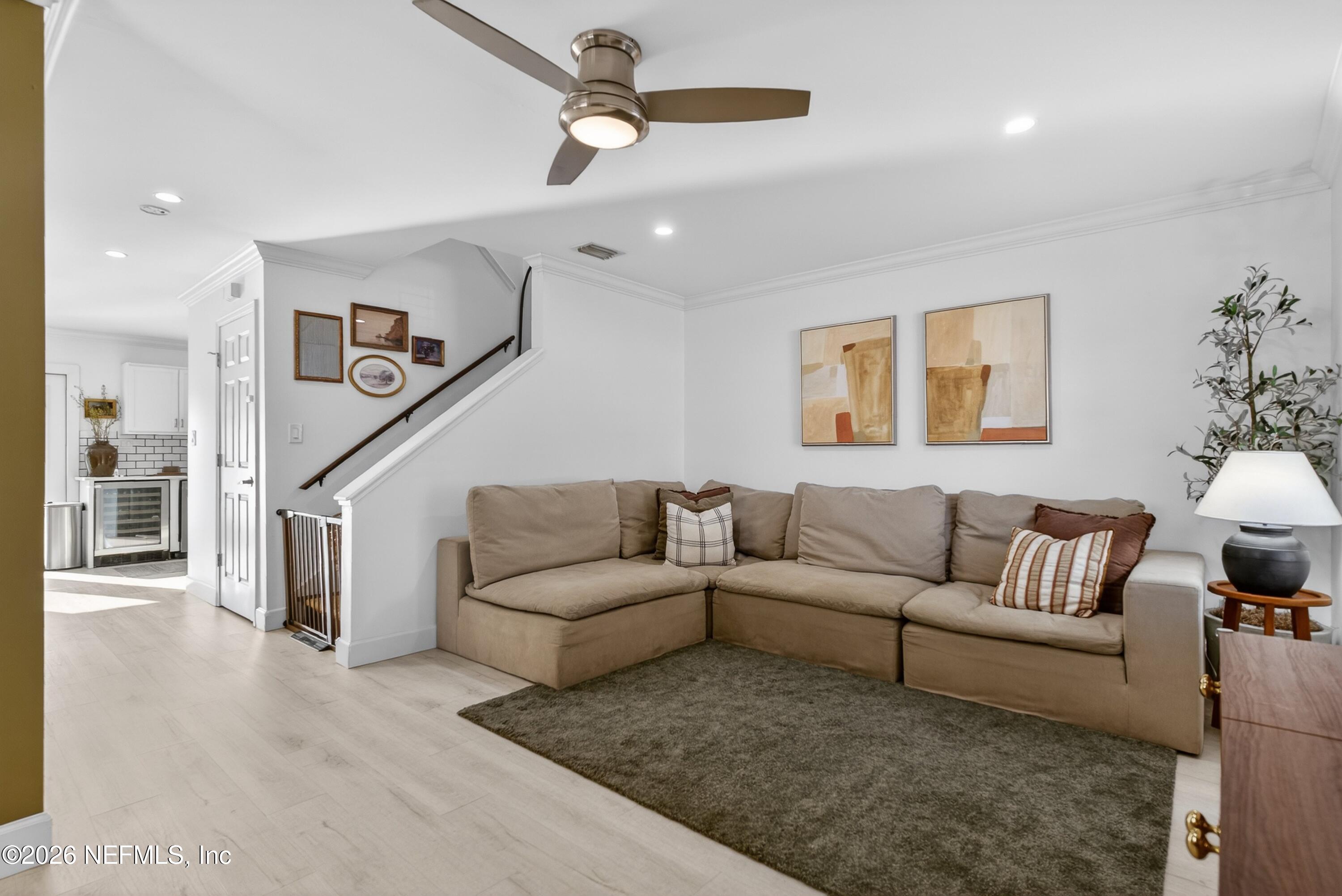 1110 Scheidel Court Atlantic Beach, FL 32233 - Photo 10 of 24 a living room with furniture and a ceiling fan