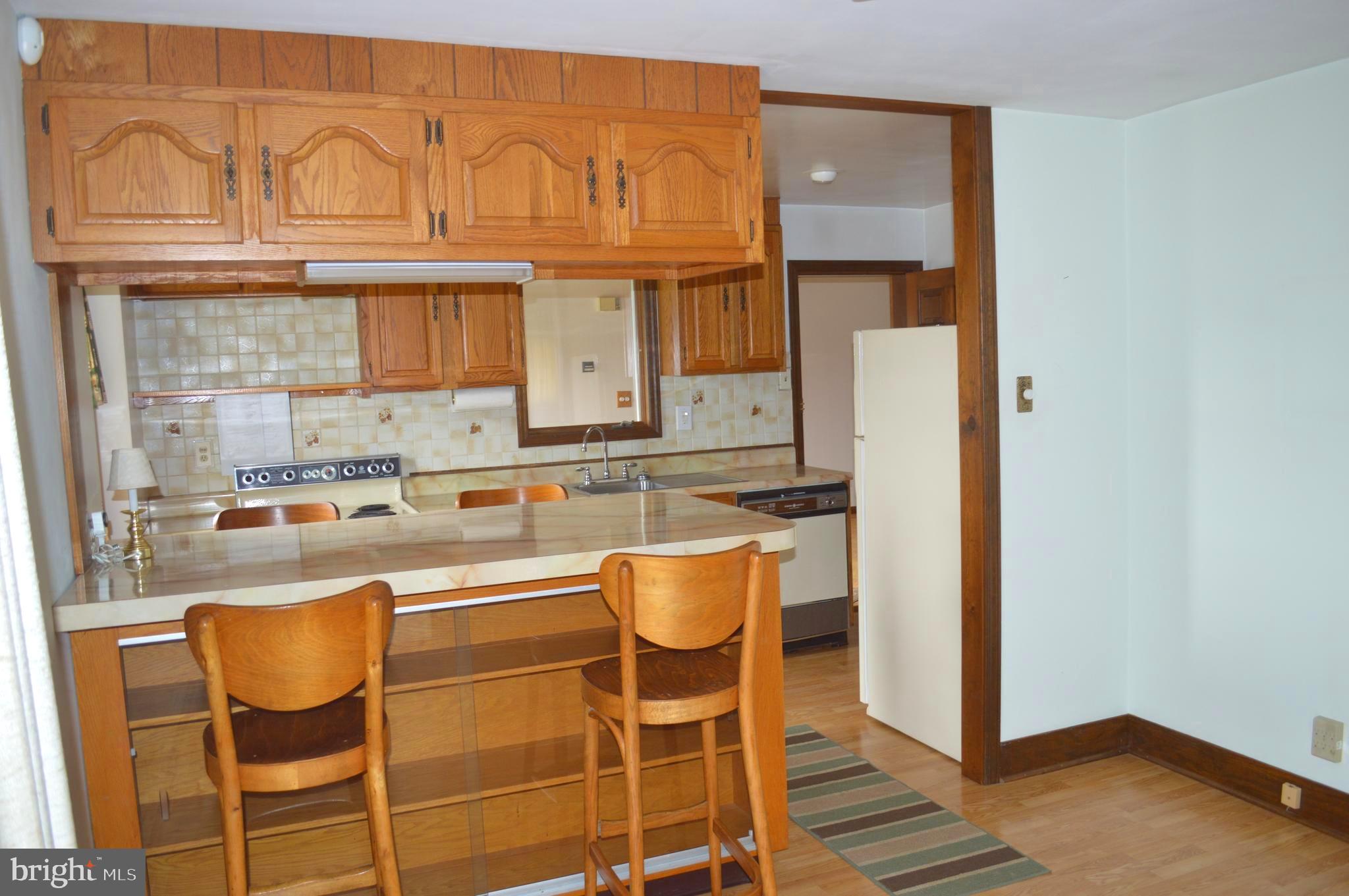 230 Dutton Mill Road Brookhaven, PA 19015 - Photo 18 of 29 Breakfast bar w/glass doors for display