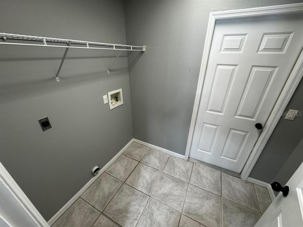 7854 Southwest 62nd Court Ocala, FL 34476 - Photo 17 of 18 a view of a room with racks on the wall