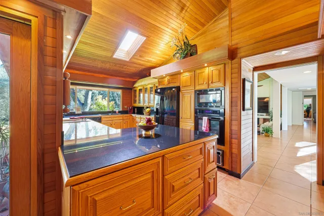 a view of a livingroom with furniture and a flat screen tv