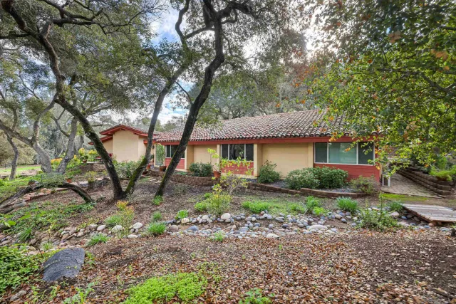 a bathroom with a double vanity sink toilet and shower