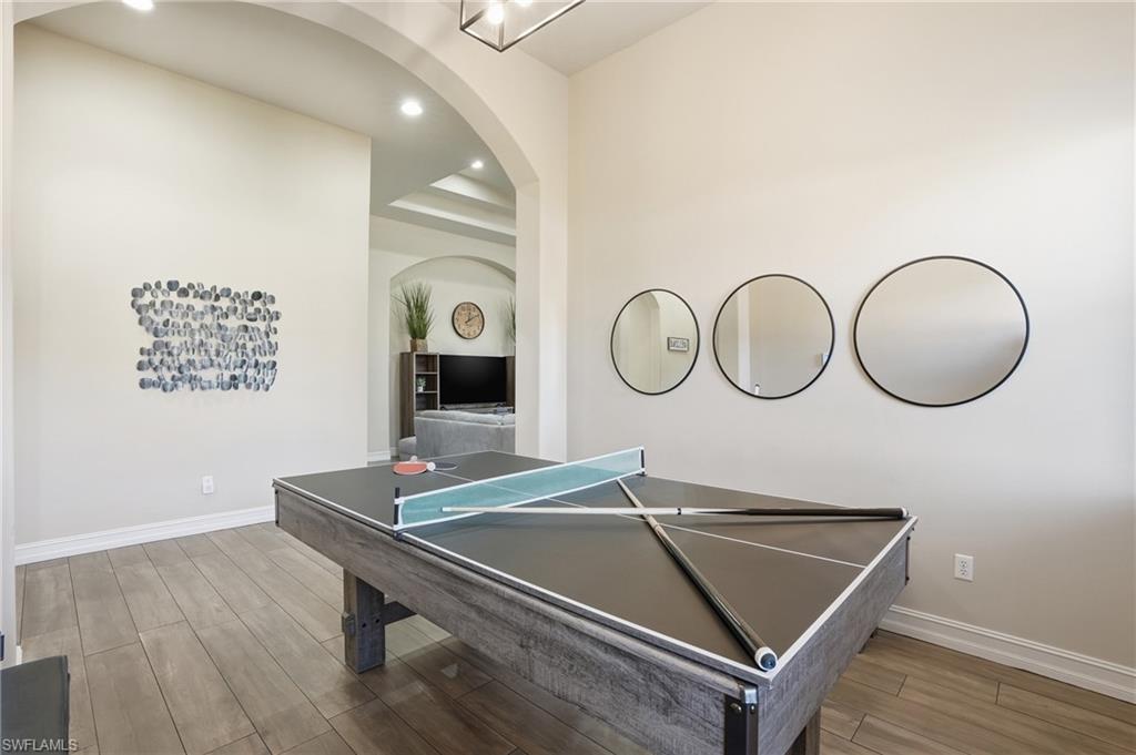 7821 Ashton Road Naples, FL 34113 - Photo 14 of 49 a view of a room with a table and chairs