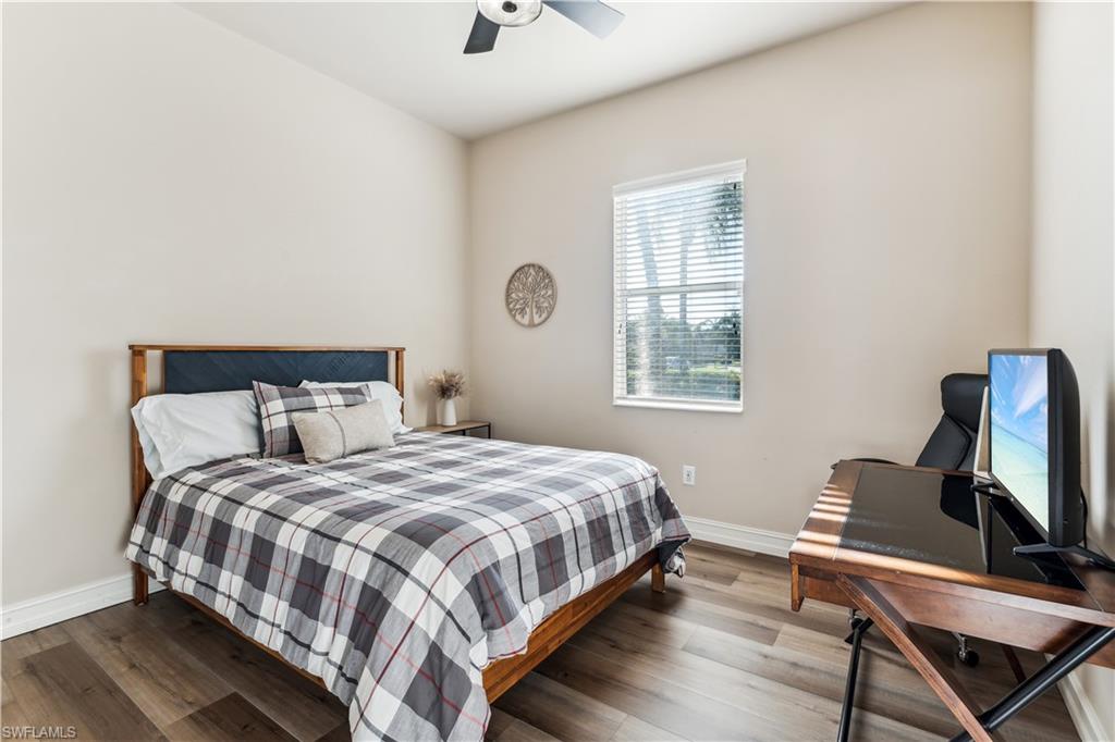 7821 Ashton Road Naples, FL 34113 - Photo 21 of 49 a bedroom with a bed and a window