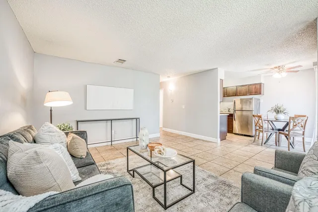 a living room with furniture and a table