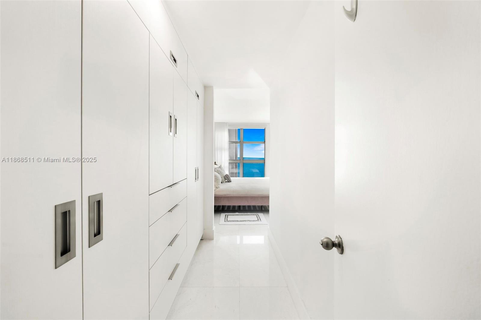 5055 Collins Avenue, Unit 10G Miami Beach, FL 33140 - Photo 14 of 20 a en suite bathroom with a shower