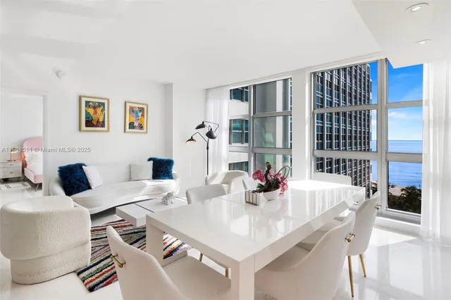a dining room with a table and chairs